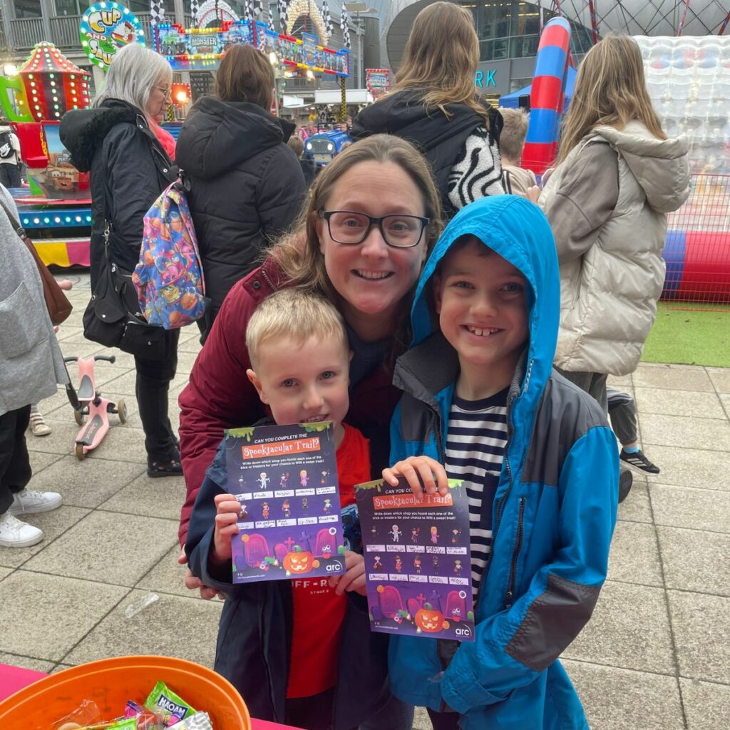 a photo of a family enjoying arc's spooktacular halloween event